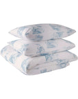 Blue and white toile de Jouy duvet cover set with pillowcases on white background