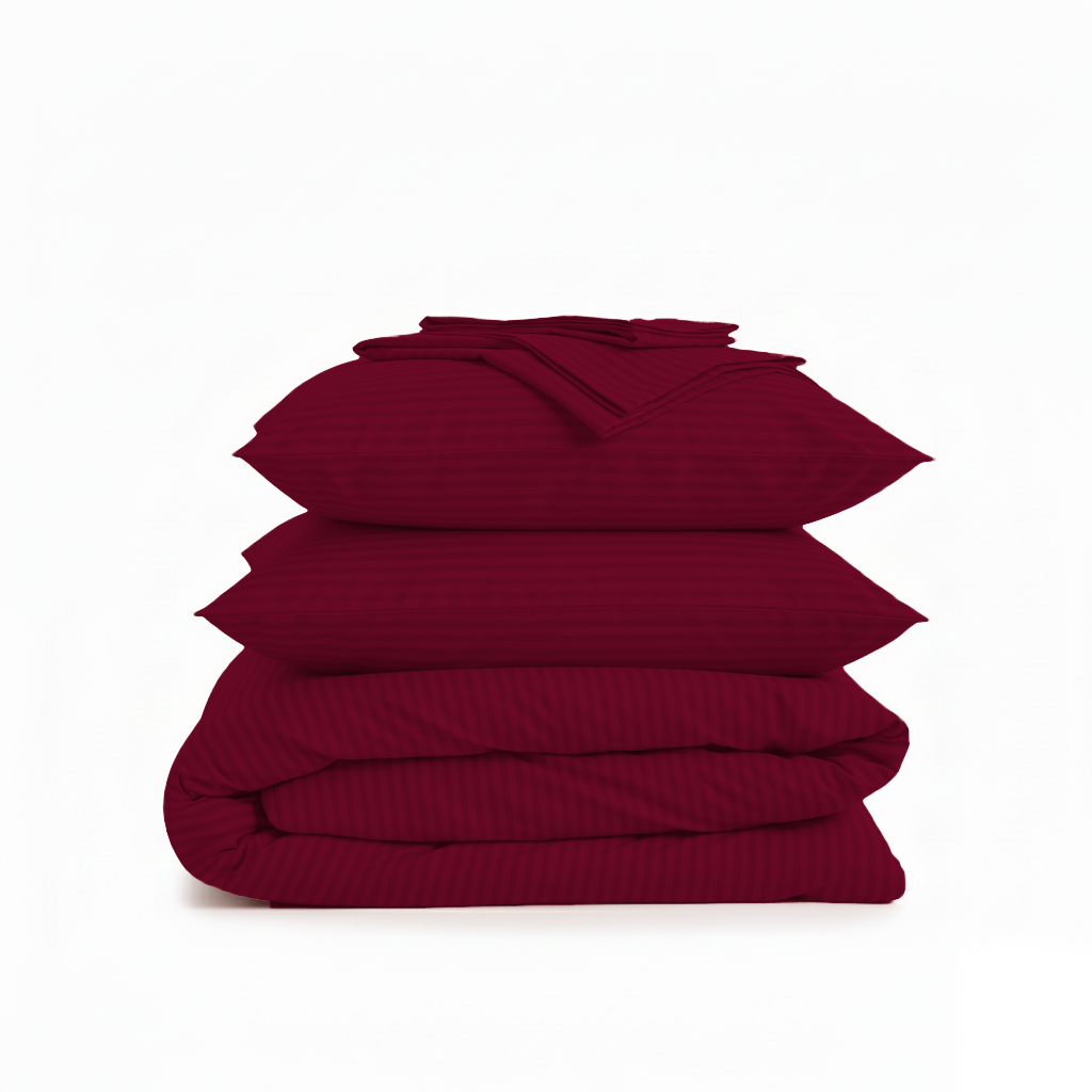 Stack of red bedding on a white background