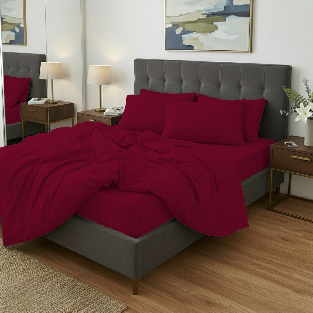 Bedroom with red bedding and gray headboard