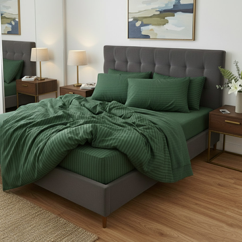 Bedroom with a green cotton sateen bedding set on a bed
