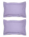 Une paire de taies d'oreiller Oxford 100 % coton uni, bordure de 5 cm.