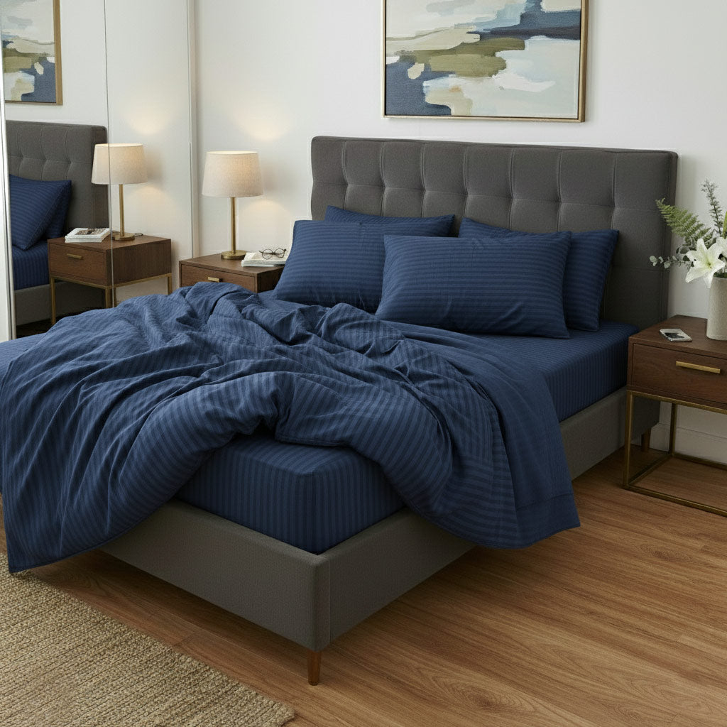 Bedroom with a blue cotton sateen bedding set on a bed