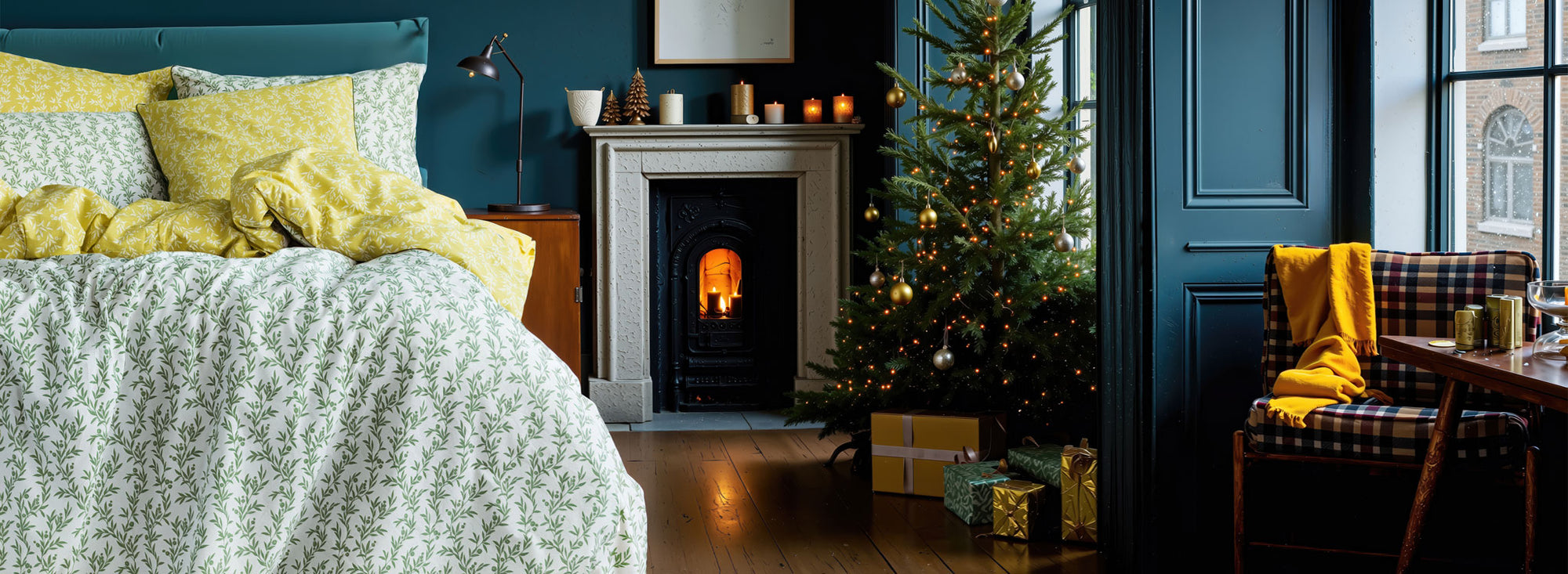 Cozy bedroom with Christmas decorations, including a tree and gift boxes.